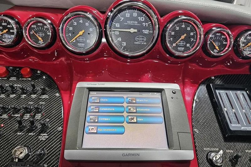 Slide: The Image of Dashboard of a 2011 Cigarette 39' Top Gun Unlimited with Garmin GPS and gauges. - 70