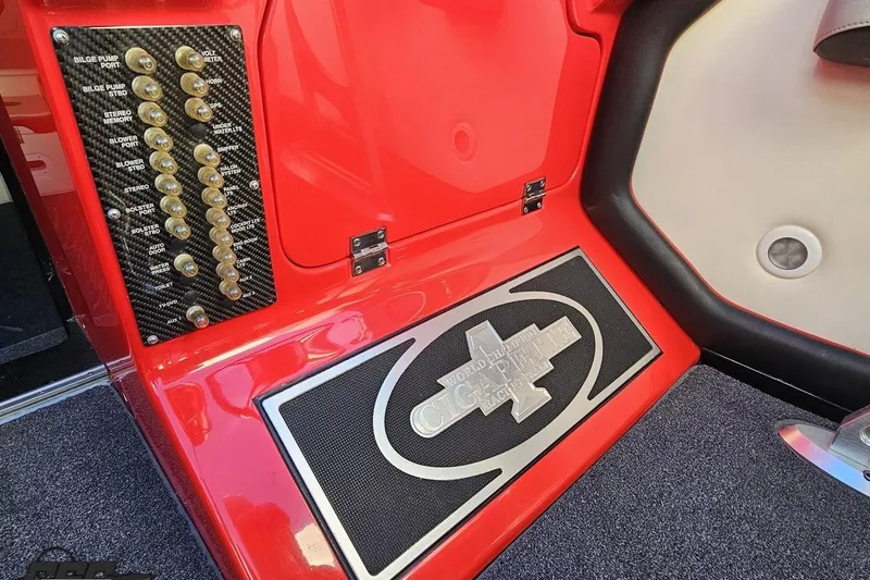 Slide: The Image of 2011 Cigarette 39' Top Gun Unlimited boat interior with control panel and logo. - 75