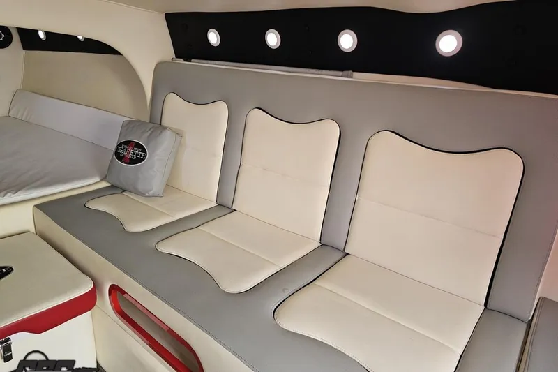 Slide: The Image of Interior of 2011 Cigarette 39' Top Gun Unlimited with white and gray seating. - 80