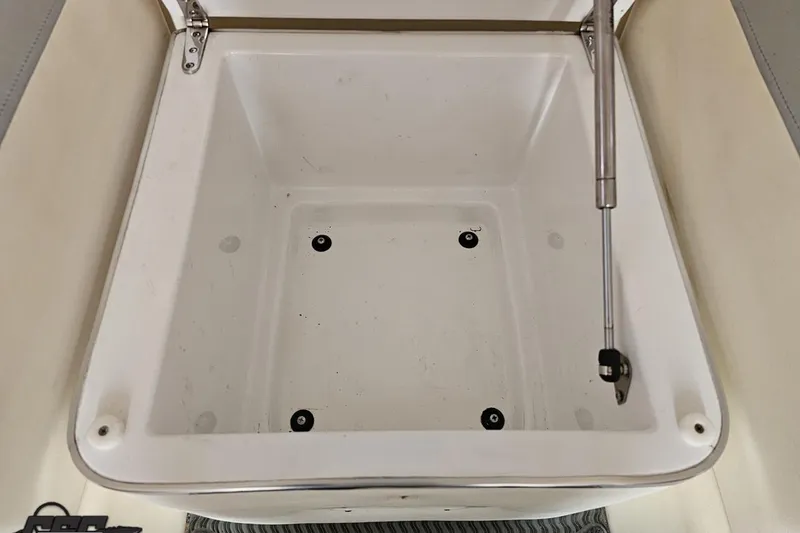 Slide: The Image of Open storage compartment in 2011 Cigarette 39' Top Gun Unlimited boat. - 83