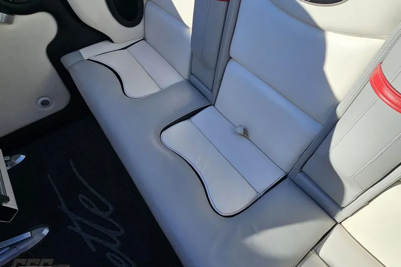 Slide: The Image of Interior seating of a 2011 Cigarette 39' Top Gun Unlimited boat, featuring white and gray upholstery. - 88