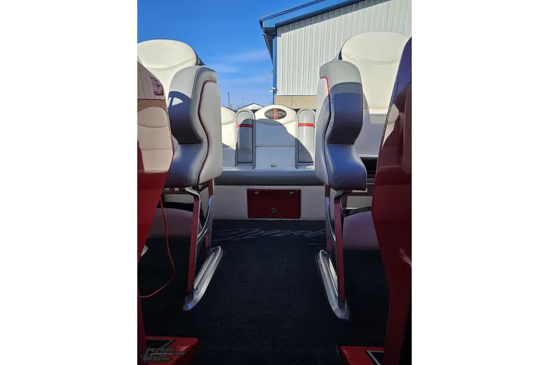 Slide: The Image of Interior of 2011 Cigarette 39' Top Gun Unlimited boat with white and red seating. - 90
