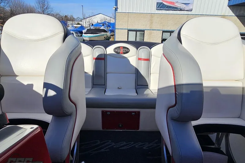 Slide: The Image of Interior of 2011 Cigarette 39' Top Gun Unlimited boat with white and gray seating. - 91