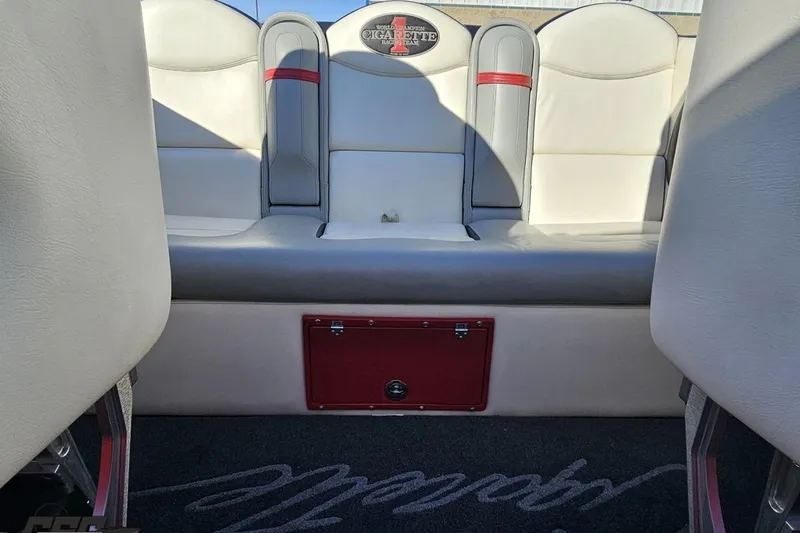 Slide: The Image of Interior of 2011 Cigarette 39' Top Gun Unlimited boat with white and gray seating. - 95
