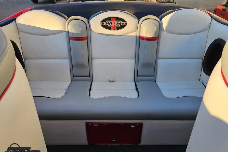 Slide: The Image of 2011 Cigarette 39' Top Gun Unlimited boat interior with white and gray seating. - 96