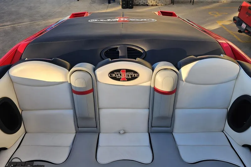 Slide: The Image of 2011 Cigarette 39' Top Gun Unlimited boat interior with white and red seating. - 97