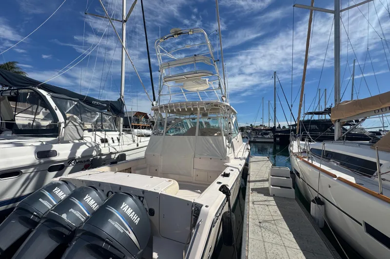 Slide: The Image of 2007 Grady-White Express 360 boat docked, featuring Yamaha outboard engines. - 1