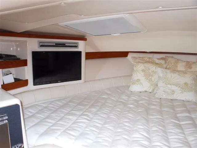 Slide: The Image of Interior of a 2007 Grady-White Express 360 with bed and TV. - 16