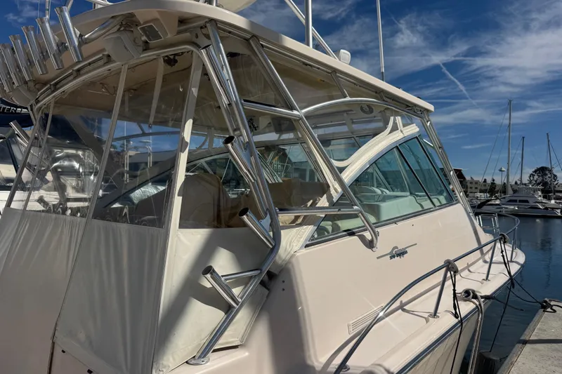 Slide: The Image of 2007 Grady-White Express 360 boat docked at marina under clear blue sky. - 2