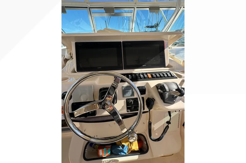 Slide: The Image of 2007 Grady-White Express 360 helm with dual screens and steering wheel. - 31