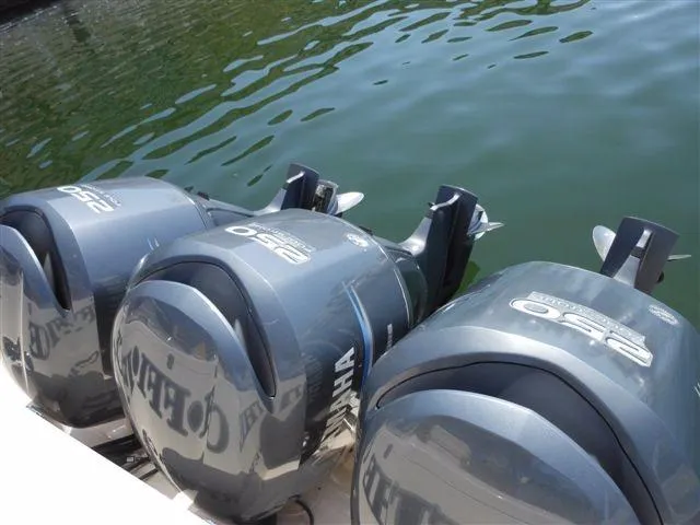 Slide: The Image of Three Yamaha outboard motors on a 2007 Grady-White Express 360 boat. - 32