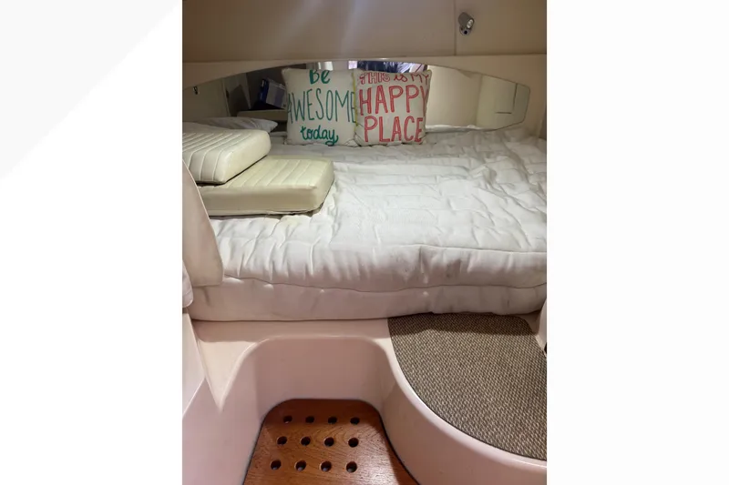 Slide: The Image of 2007 Grady-White Express 360 cabin interior with cozy bedding and decorative pillows. - 38