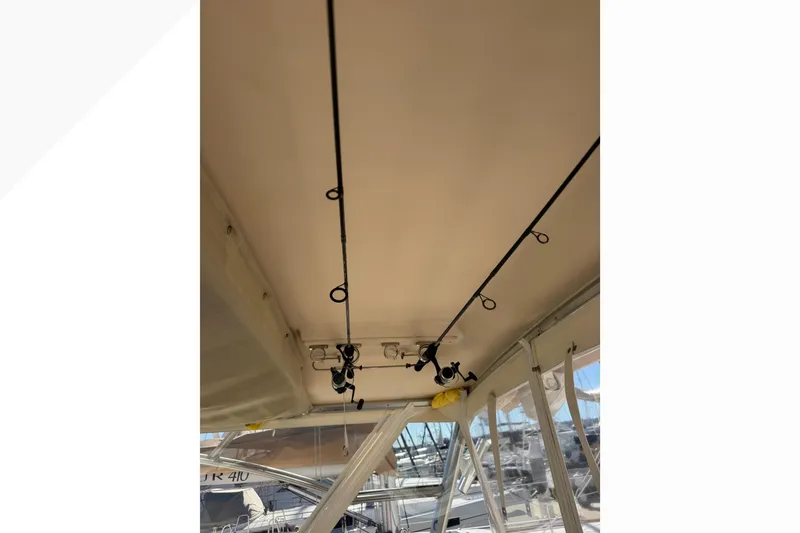 Slide: The Image of 2007 Grady-White Express 360 boat interior with fishing rods on ceiling rack. - 42