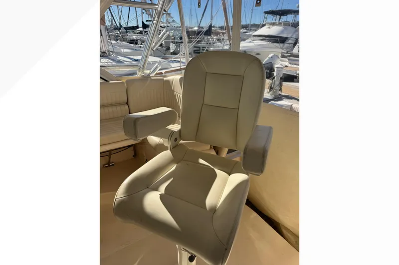 Slide: The Image of Captain's chair on 2007 Grady-White Express 360 boat, with marina view. - 51