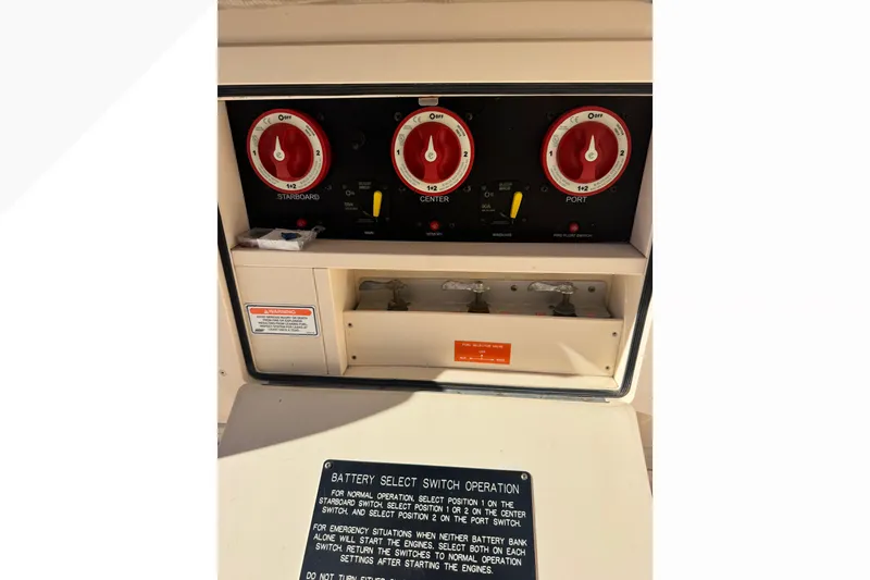 Slide: The Image of Control panel of a 2007 Grady-White Express 360 boat with battery switches. - 56