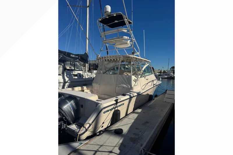 Slide: The Image of 2007 Grady-White Express 360 boat docked at marina with Yamaha engines. - 58