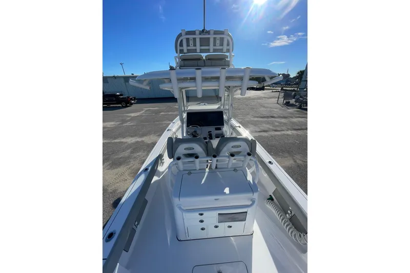 Slide: The Image of 2020 Sportsman Masters 267OE Bay Boat dashboard with steering wheel and dual displays. - 15