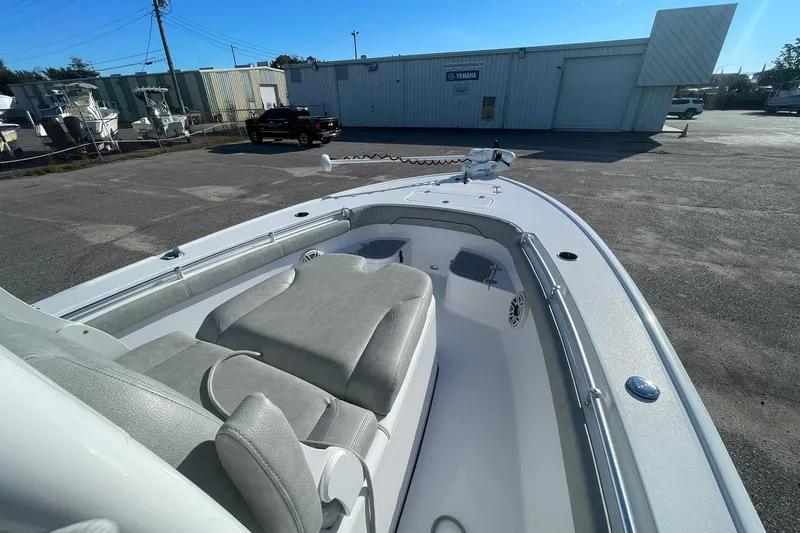 Slide: The Image of 2020 Sportsman Masters 267OE Bay Boat bow with trolling motor in a parking lot. - 20