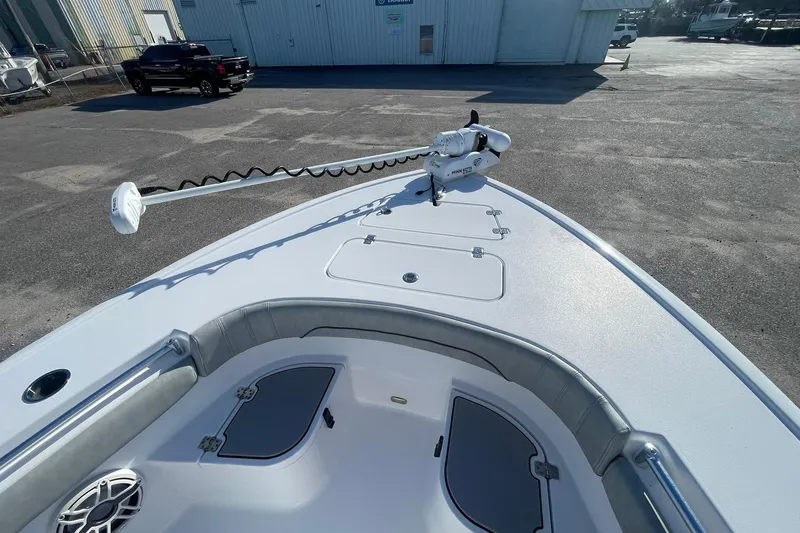 Slide: The Image of 2020 Sportsman Masters 267OE Bay Boat, sleek design, spacious deck, outdoor setting. - 21