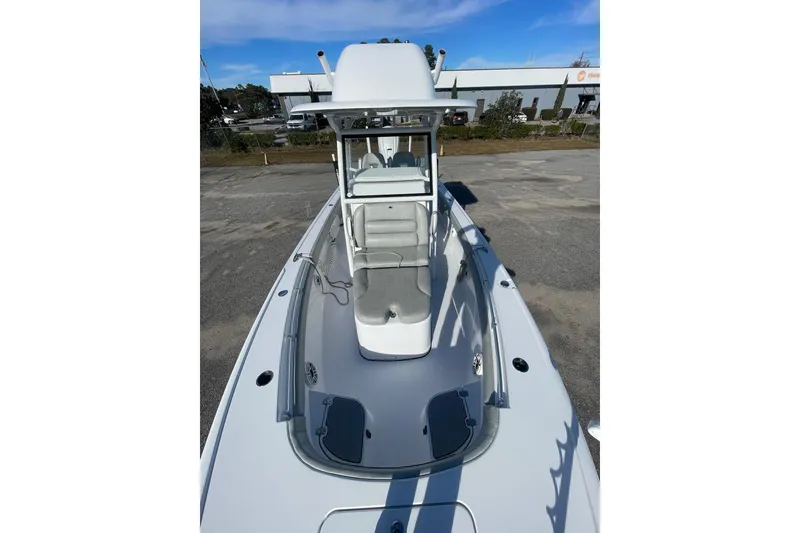 Slide: The Image of 2020 Sportsman Masters 267OE Bay Boat interior with dual seats and steering wheel. - 22