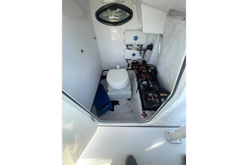 Slide: The Image of Garmin display on 2020 Sportsman Masters 267OE Bay Boat showing fuel and trip data. - 24