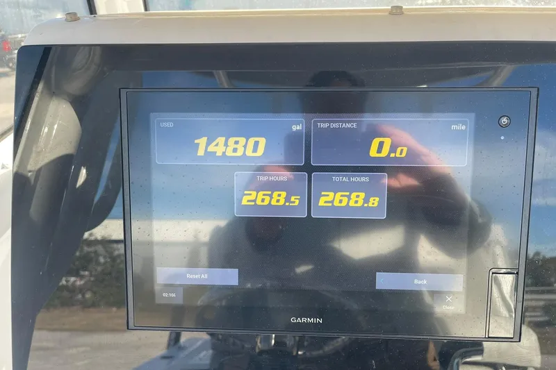 Slide: The Image of JL Audio MediaMaster display on 2020 Sportsman Masters 267OE Bay Boat, FM 102.7 playing. - 25