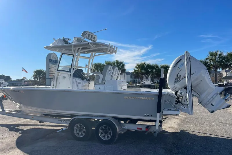 Slide: The Image of 2020 Sportsman Masters 267OE Bay Boat on trailer under clear blue sky. - 27