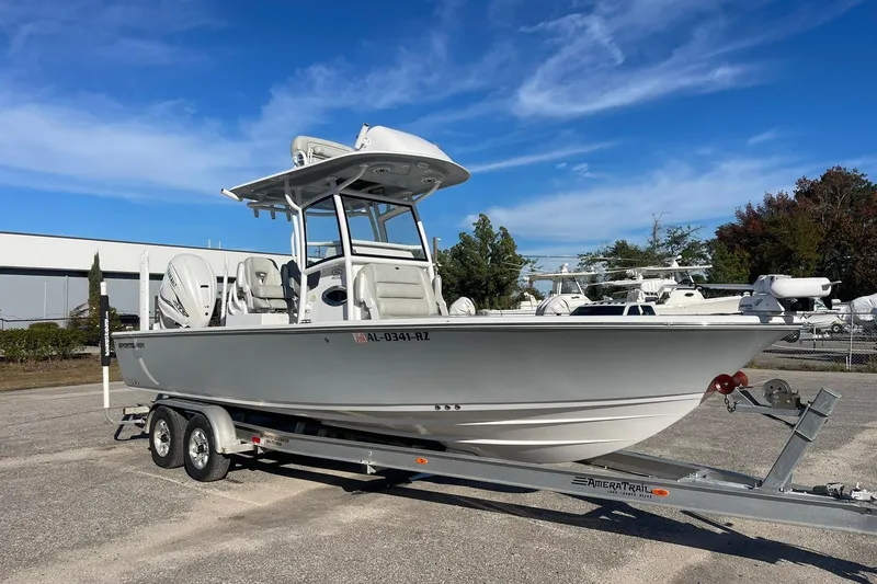 Slide: The Image of 2020 Sportsman Masters 267OE Bay Boat covered with a protective tarp under clear blue sky. - 28
