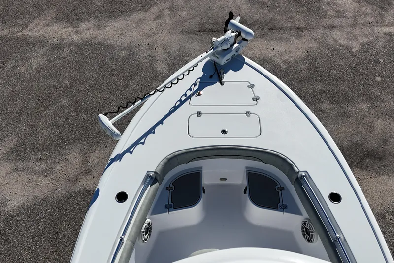 Slide: The Image of 2020 Sportsman Masters 267OE Bay Boat cockpit with steering wheel and rod holders. - 6