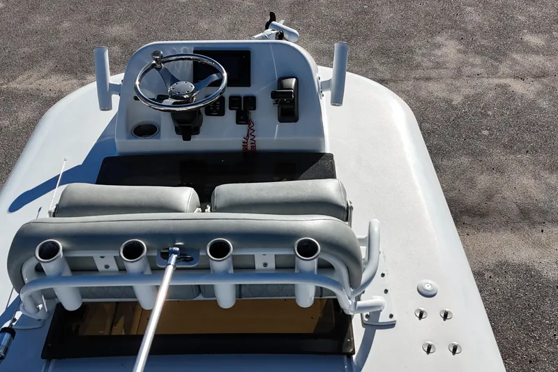 Slide: The Image of 2020 Sportsman Masters 267OE Bay Boat interior with dual seats and steering console. - 7