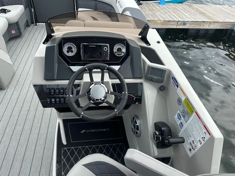 Slide: The Image of Starcraft SLS 3 R 2026 helm console at a dock. - 11