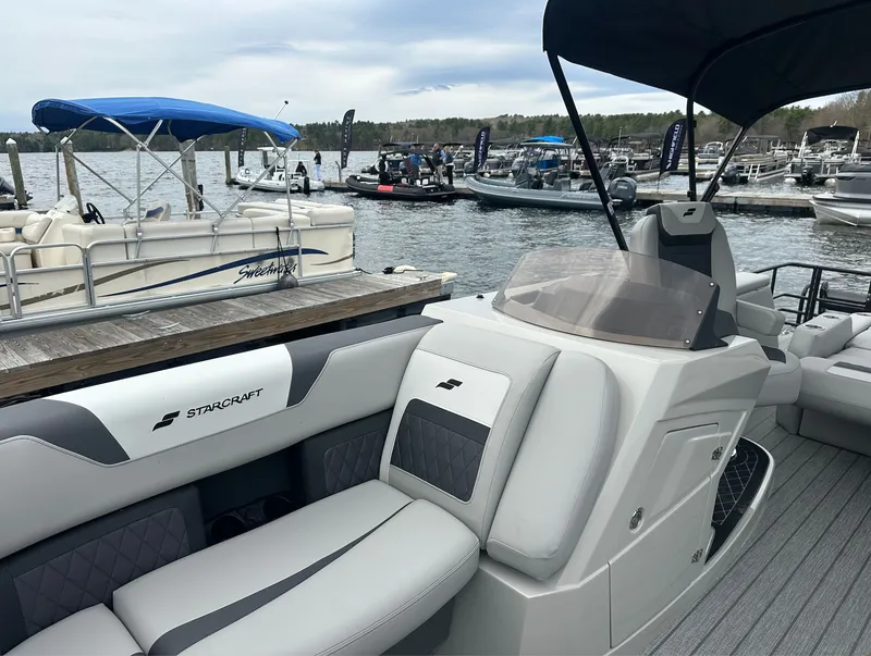 Slide: The Image of Starcraft SLS 3 R 2026 pontoon boat at dock, modern design. - 13