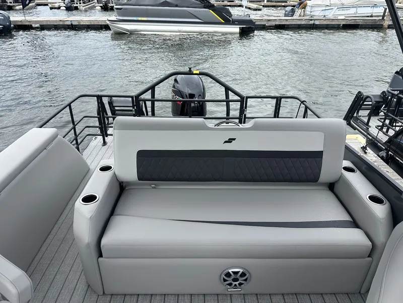 Slide: The Image of Starcraft SLS 3 R 2026 boat with gray seating area by the water. - 5