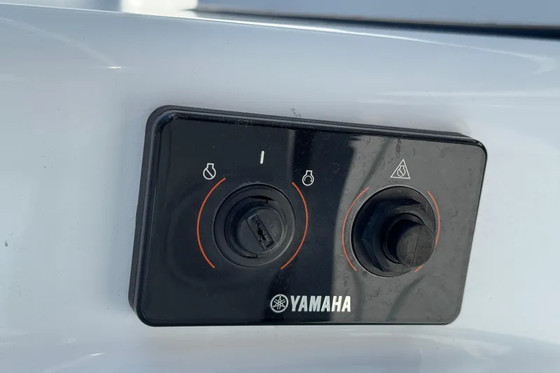 Slide: The Image of Yamaha control panel on 2018 Yellowfin 21 Bay boat, featuring dual switches. - 15