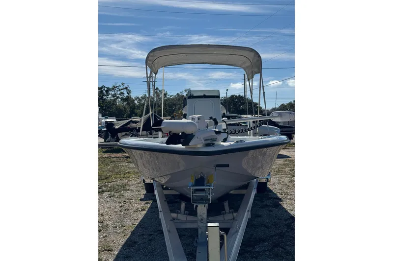 Slide: The Image of 2018 Yellowfin 21 Bay boat on trailer under clear sky. - 2