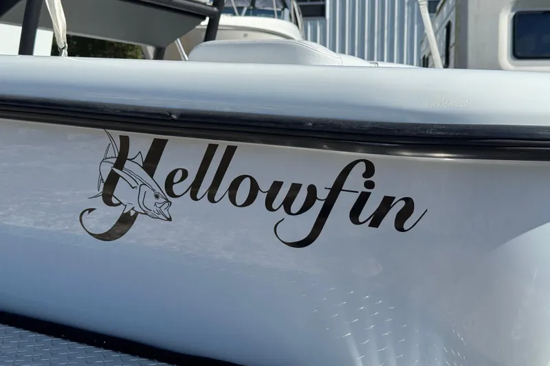 Slide: The Image of 2018 Yellowfin 21 Bay boat with logo and fish graphic on the side. - 7