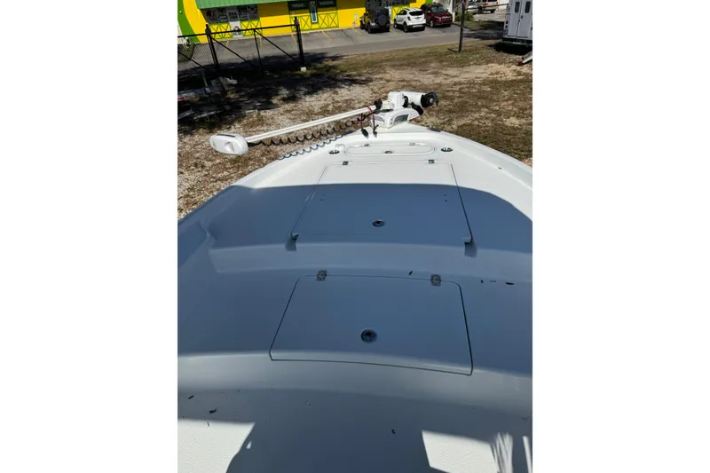 Slide: The Image of 2018 Yellowfin 21 Bay boat deck with storage compartments and trolling motor. - 8