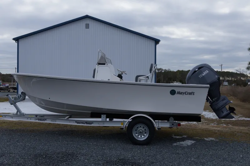 The Image of 2026 May-Craft 208 CC boat on trailer, parked outdoors near a building. - 7