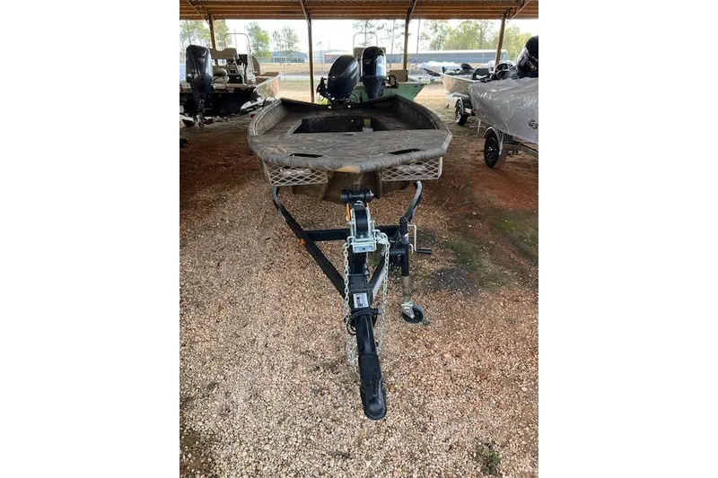 Slide: The Image of 2026 G3 Gator Tough 17 DK boat on trailer, parked under shelter. - 4