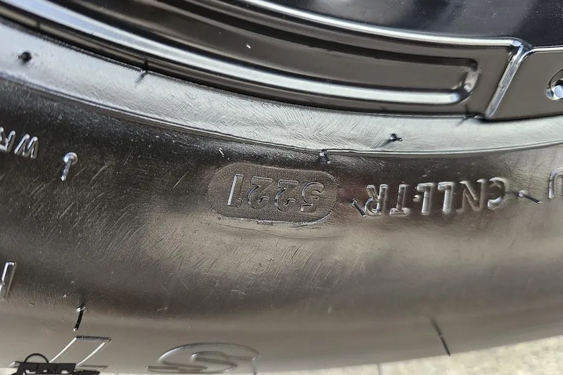 Slide: The Image of Close-up of a tire on a 2003 Baja 25 Outlaw boat. - 25