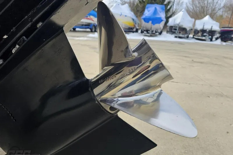 Slide: The Image of Close-up of a 2003 Baja 25 Outlaw boat propeller, shiny and metallic. - 32