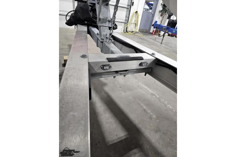 Slide: The Image of 2003 Baja 25 Outlaw boat trailer hitch in a garage setting. - 43