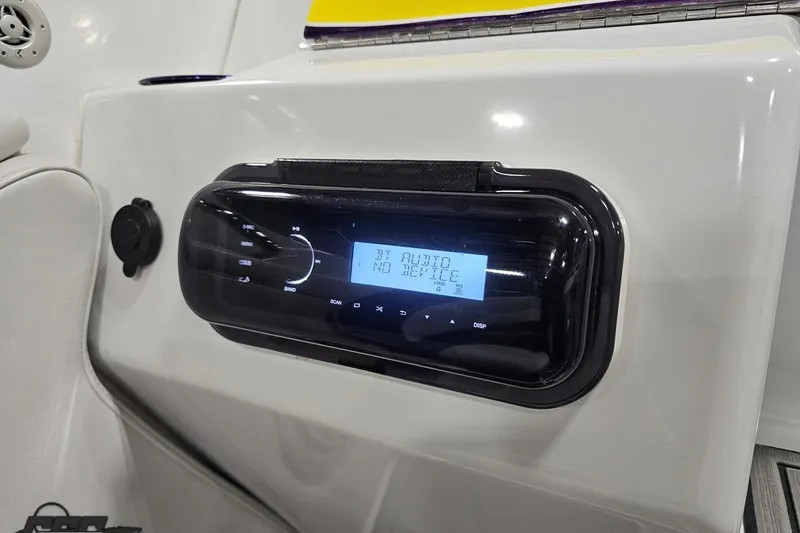 Slide: The Image of 2003 Baja 25 Outlaw boat stereo system with digital display and controls. - 62