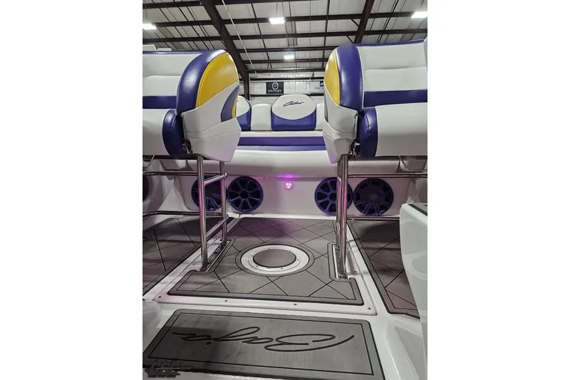 Slide: The Image of 2003 Baja 25 Outlaw boat interior with stylish seating and modern design. - 86