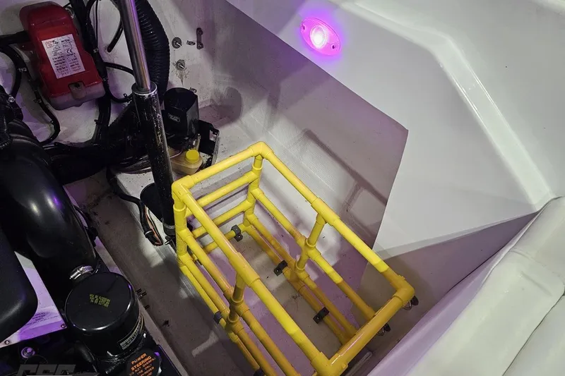 Slide: The Image of Engine compartment of 2003 Baja 25 Outlaw with yellow frame and purple light. - 96