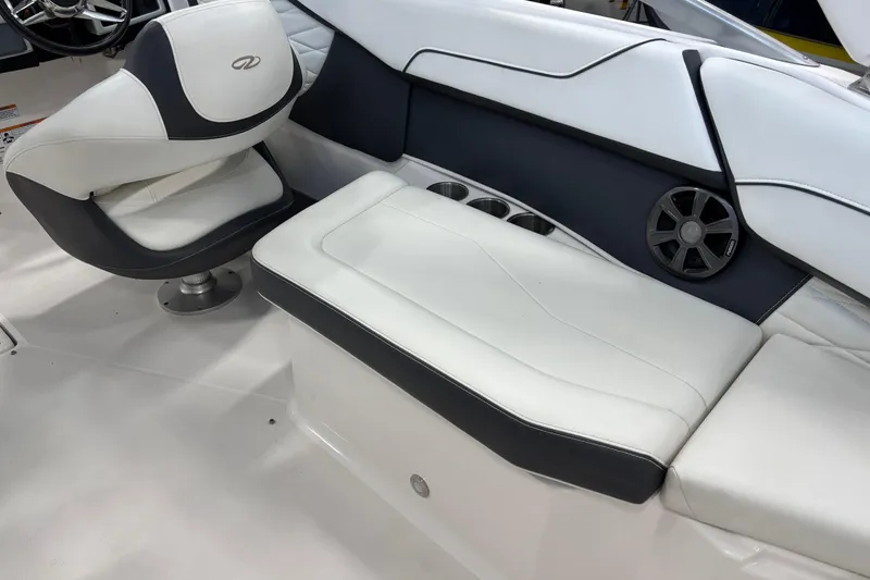 Slide: The Image of 2018 Regal 23 OBX boat interior with white seating and wooden table. - 11