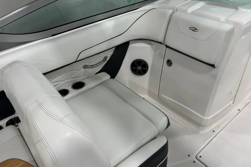 Slide: The Image of 2018 Regal 23 OBX boat interior with wooden table and white seating. - 12