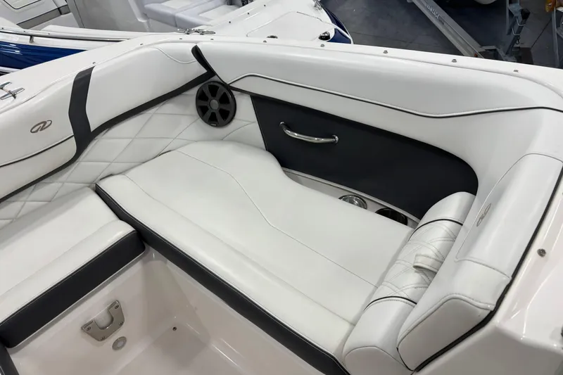 Slide: The Image of 2018 Regal 23 OBX boat interior with white seating and black accents. - 16