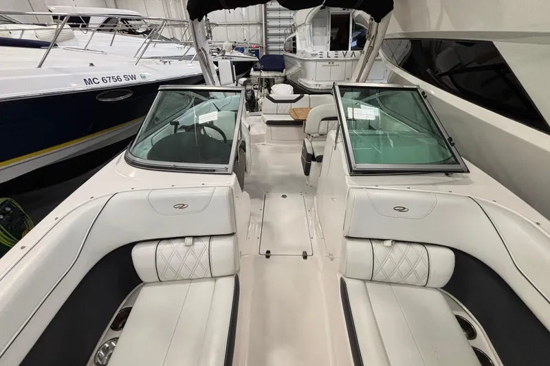 Slide: The Image of Manufacturer Provided Image: 2018 Regal 23 OBX boat interior with wooden table and white seating. - 20