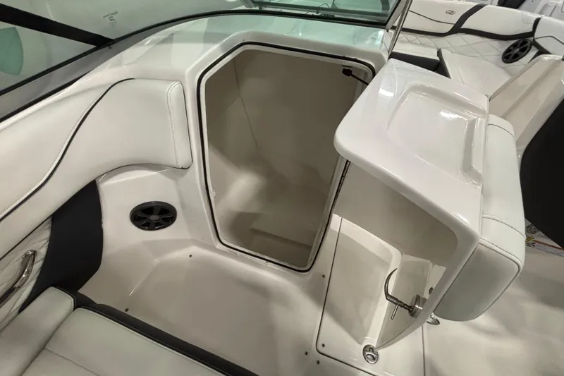 Slide: The Image of Luxurious interior of 2018 Regal 23 OBX boat with white seating and wooden table. - 22